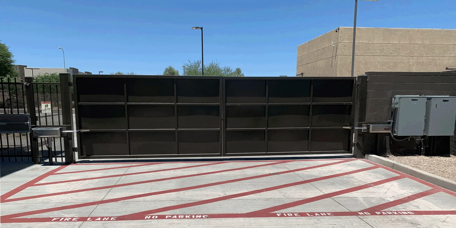 HySecurity HydraSwing hydraulic swing gate operator on a commercial gate