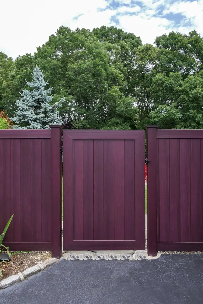 Illusions mahogany vinyl double gate in a privacy fence
