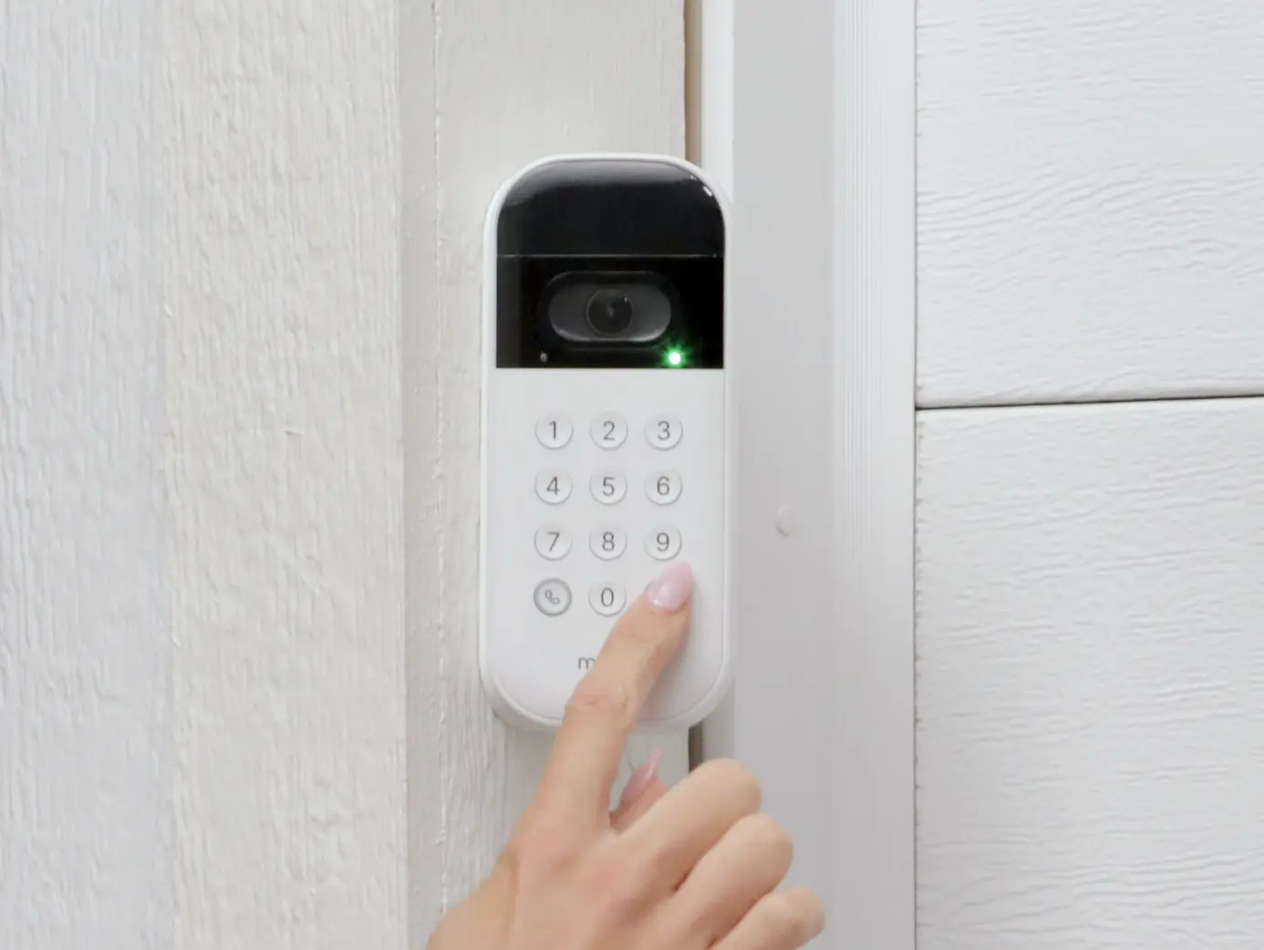 LiftMaster keypad mounted by a garage door