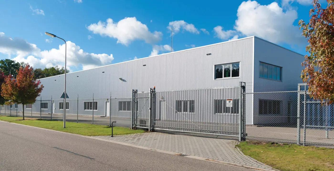 Commercial industrial facility gate with a slide operator