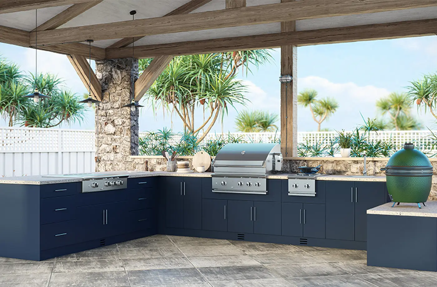 Outdoor kitchen with navy cabinets and built-in grill on a stone patio