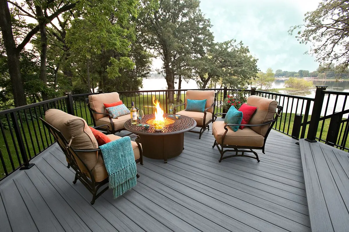MoistureShield composite deck with black metal railing and fire pit seating