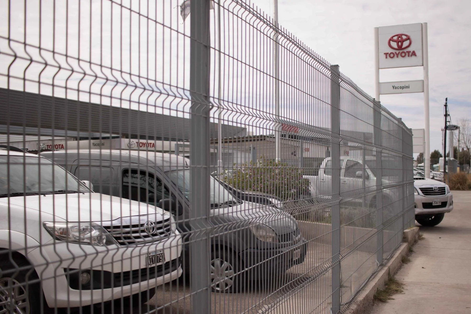 Grey Acmafor Perimeter fence around a vehicle lot