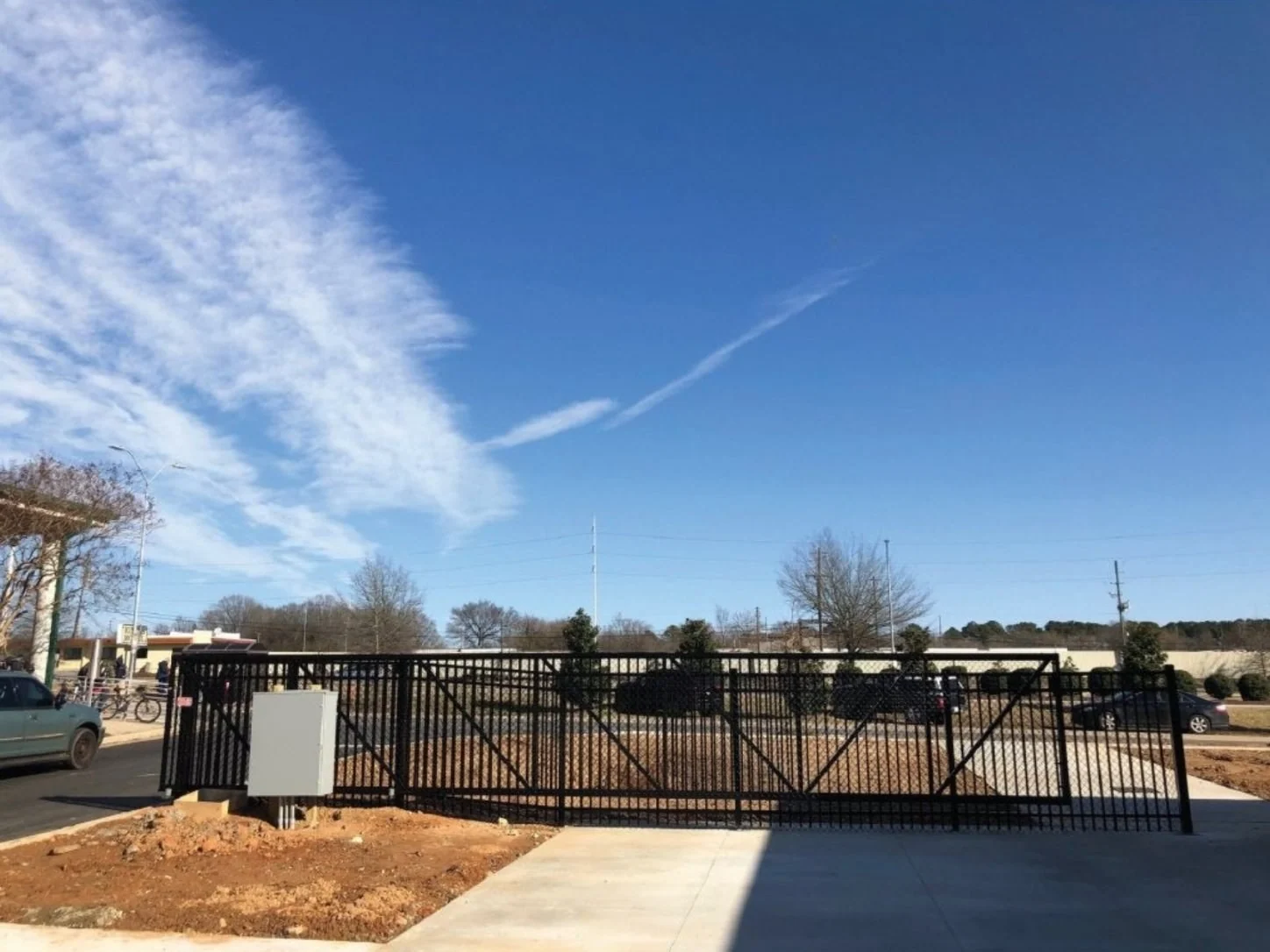 Custom cantilever gate across a commercial driveway