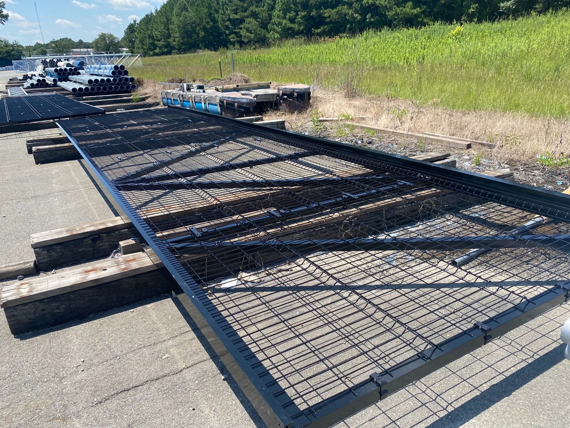 Black cantilever gate on a work site