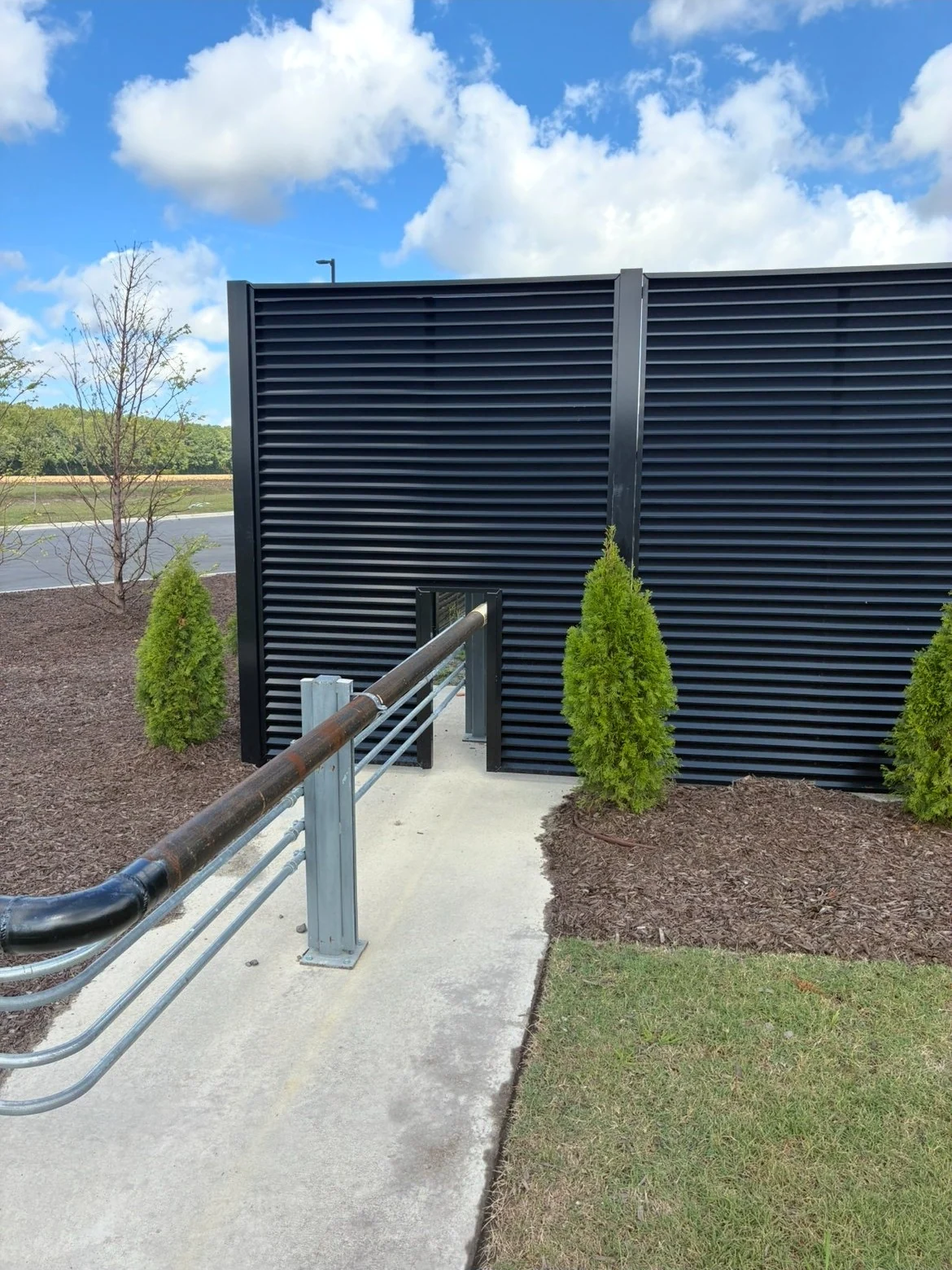 AirVeil louver screen wall beside a walkway