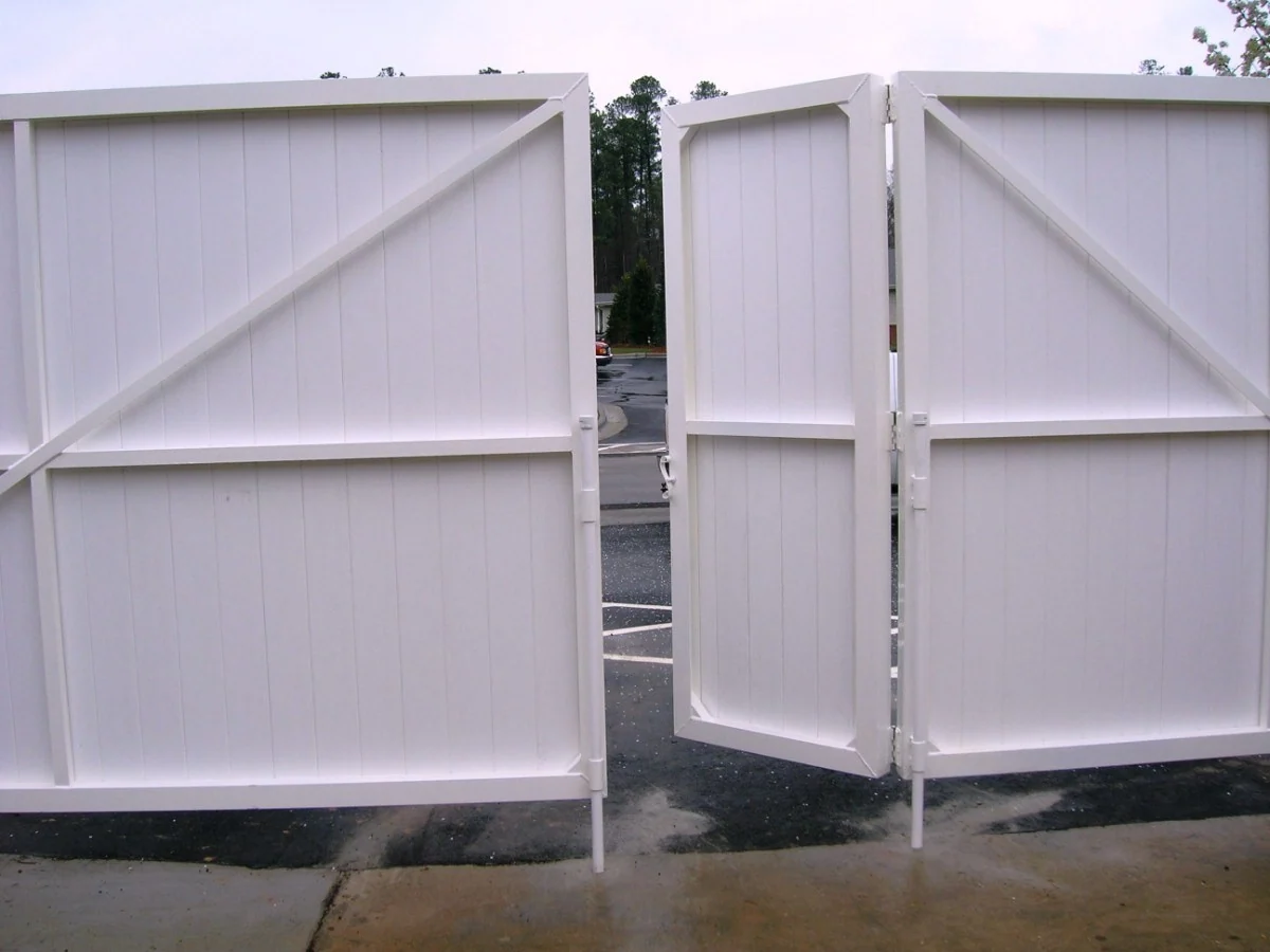 Dumpster enclosure gate leaves shown open
