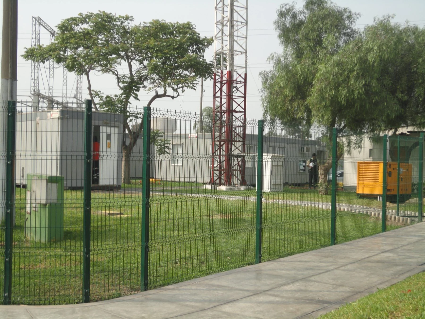 Green Acmafor Perimeter fence on a lawn