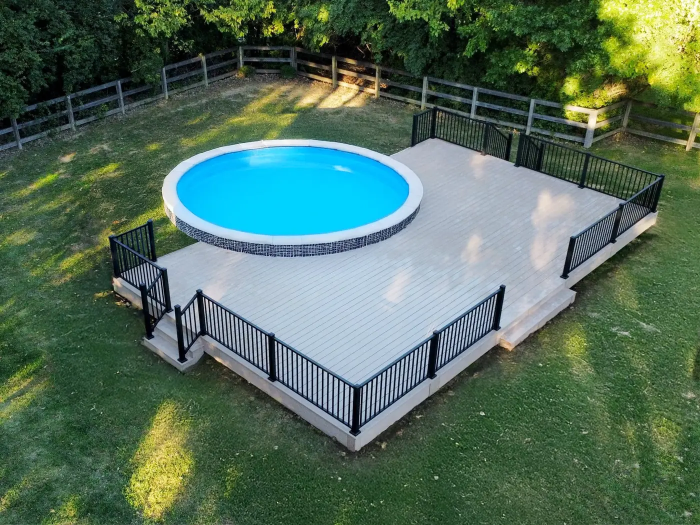 RailMaster aluminum railing around an above-ground pool deck