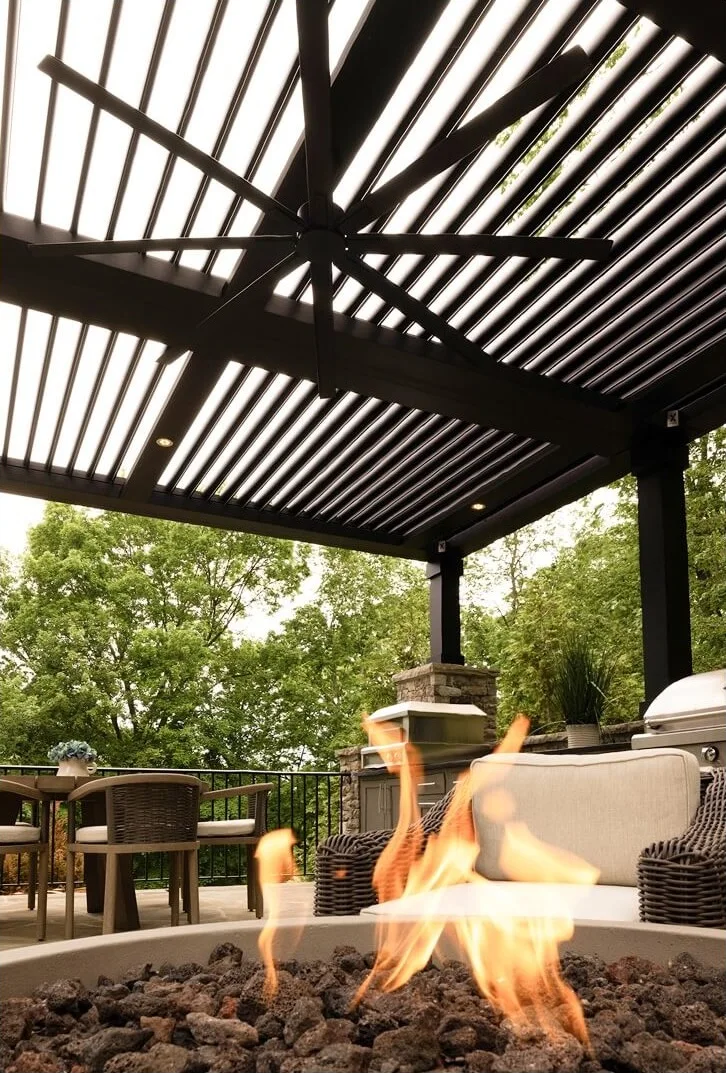 StruXure Pergola X louvered pergola with ceiling fan over a fire pit seating area