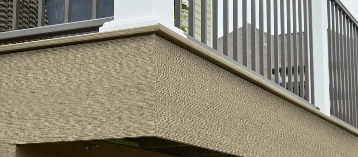 TimberTech composite fascia wrapping a deck corner under railing