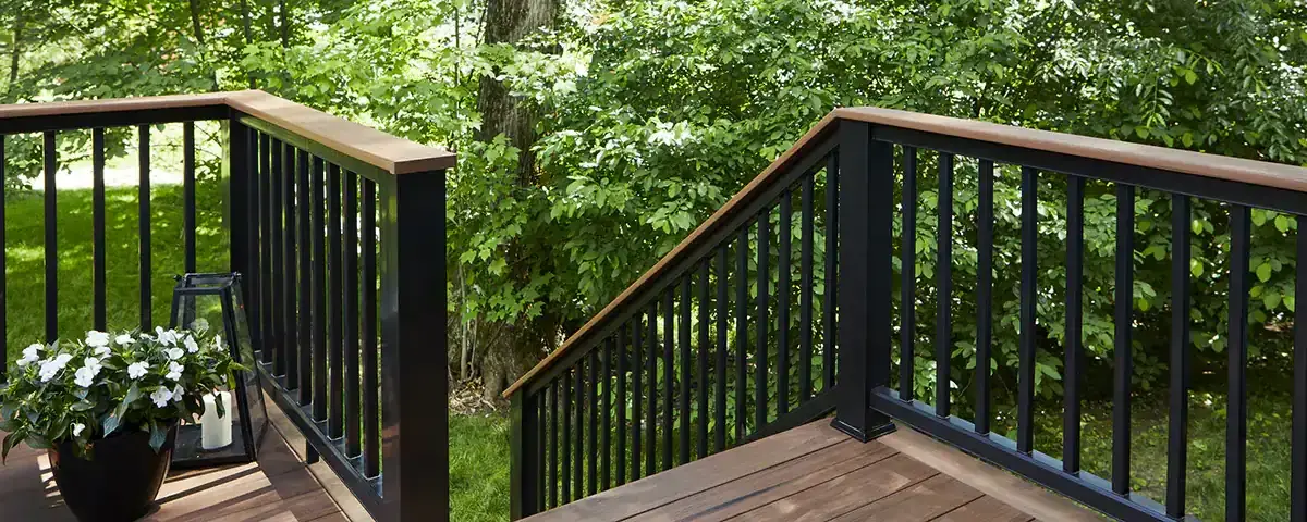 TimberTech black railing with handrail along stairs