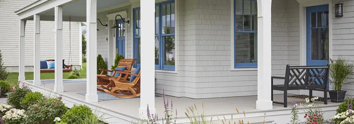 TimberTech porch edge with fascia and white columns