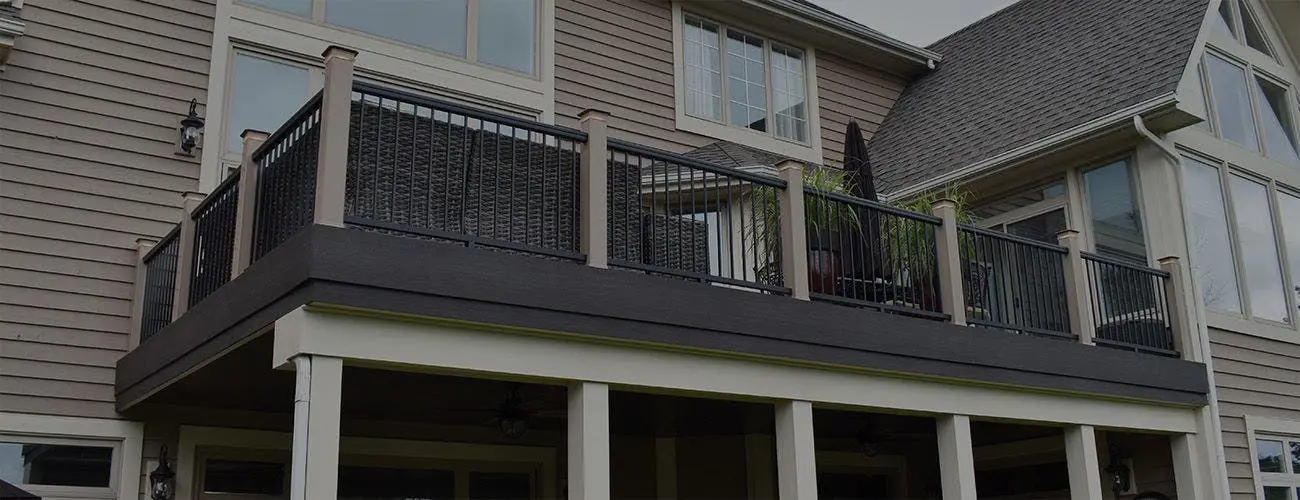 TimberTech dark deck fascia and railing on a two-story deck