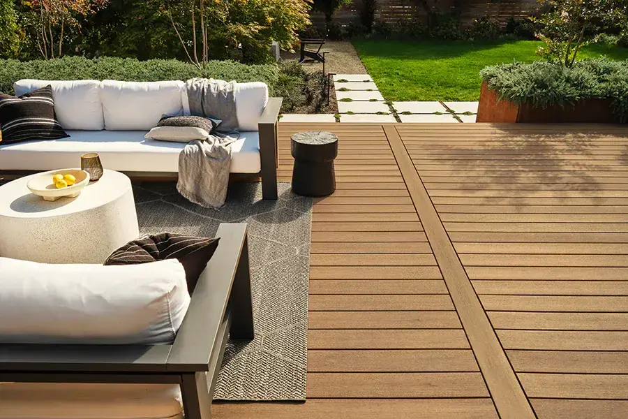 TimberTech composite deck with lounge seating on a garden patio
