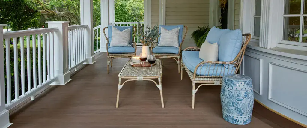 TimberTech porch with white railing and cushioned seating