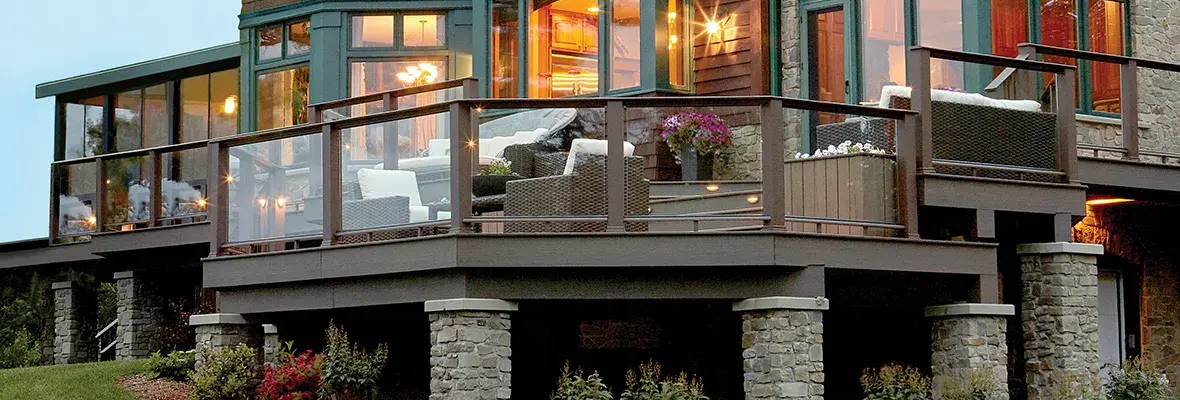 Elevated TimberTech deck with enclosed dry area beneath on stone piers