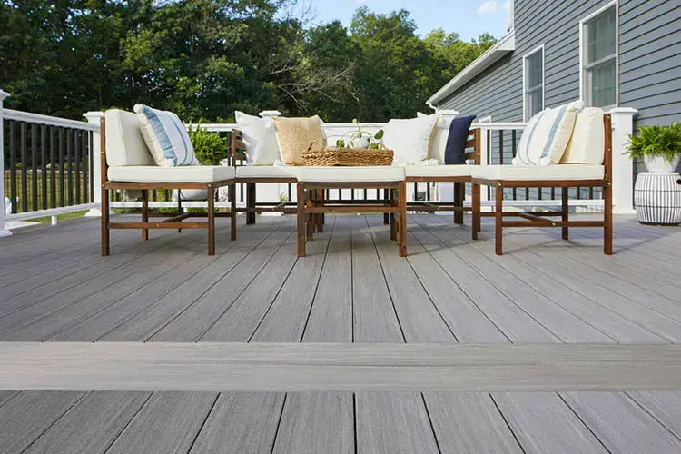 TimberTech composite deck with white railing and patio seating