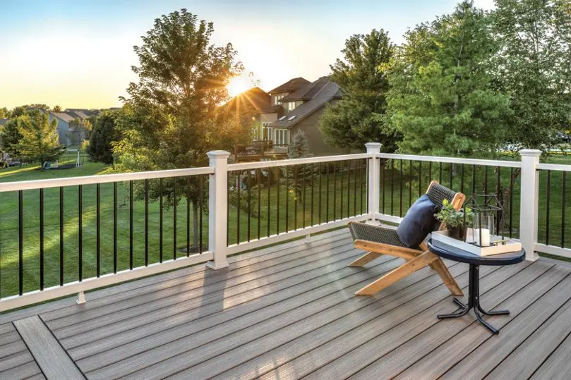 Trex Enhance composite railing in white on a gray composite deck