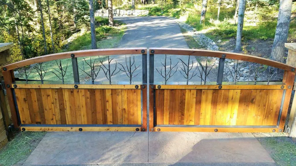 Wooden double swing gate powered by a Patriot gate operator