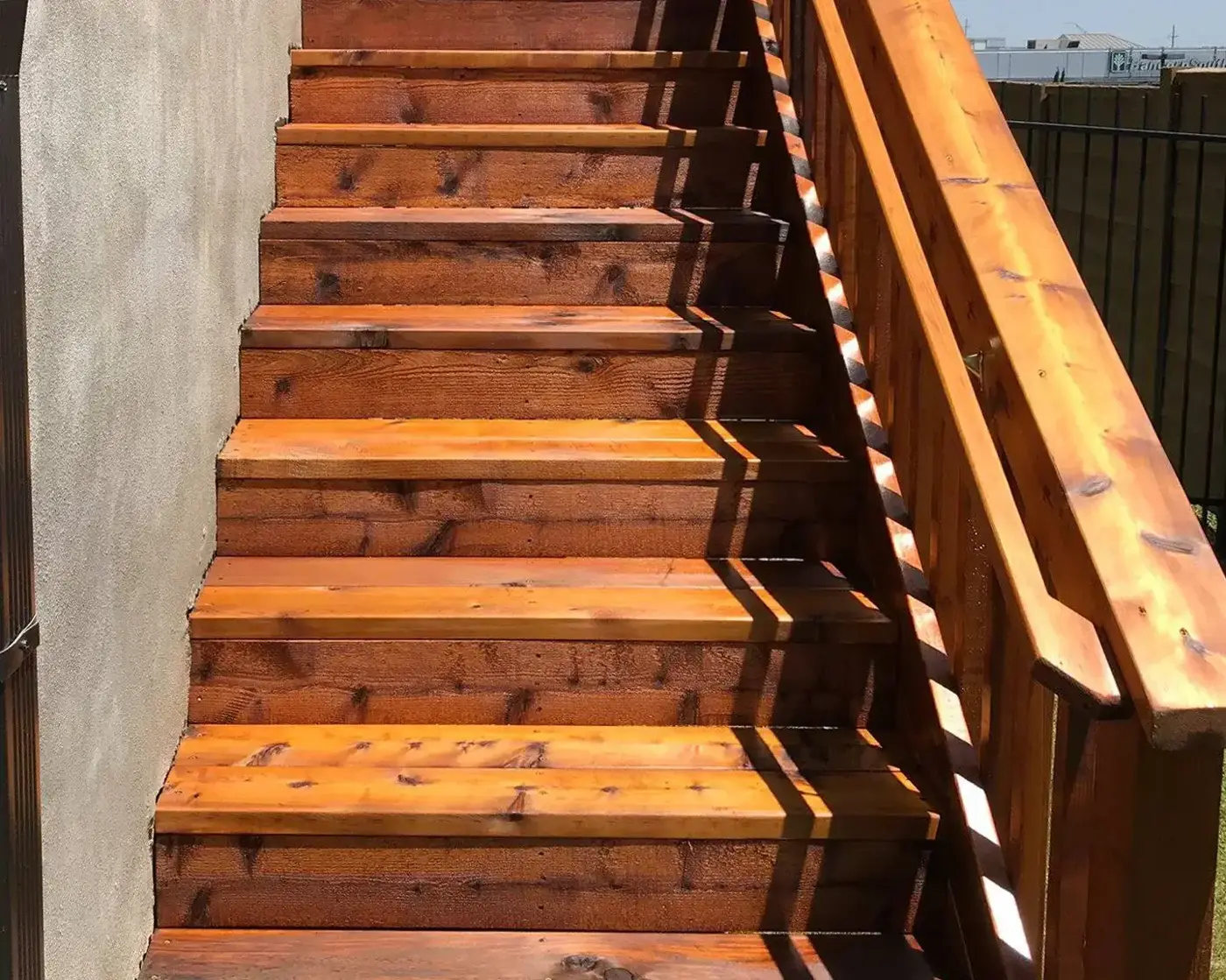Cedar-tone stained wood stair treads and railing