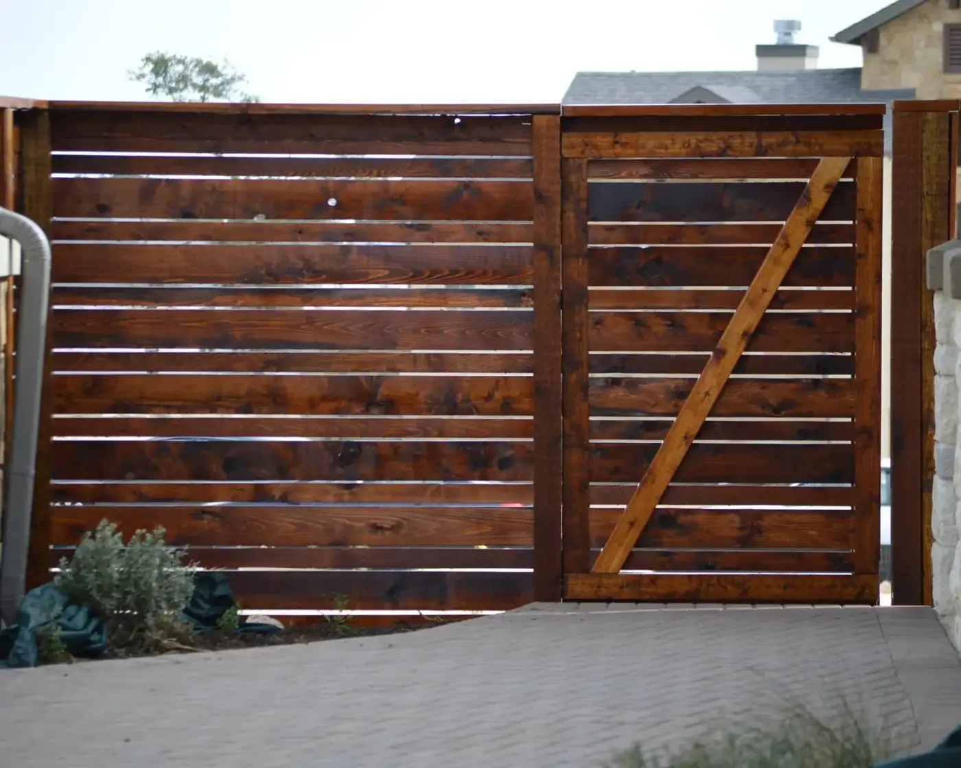 Wood fence rails and post-and-rail - stained cedar wood fence installed, Wood Defender