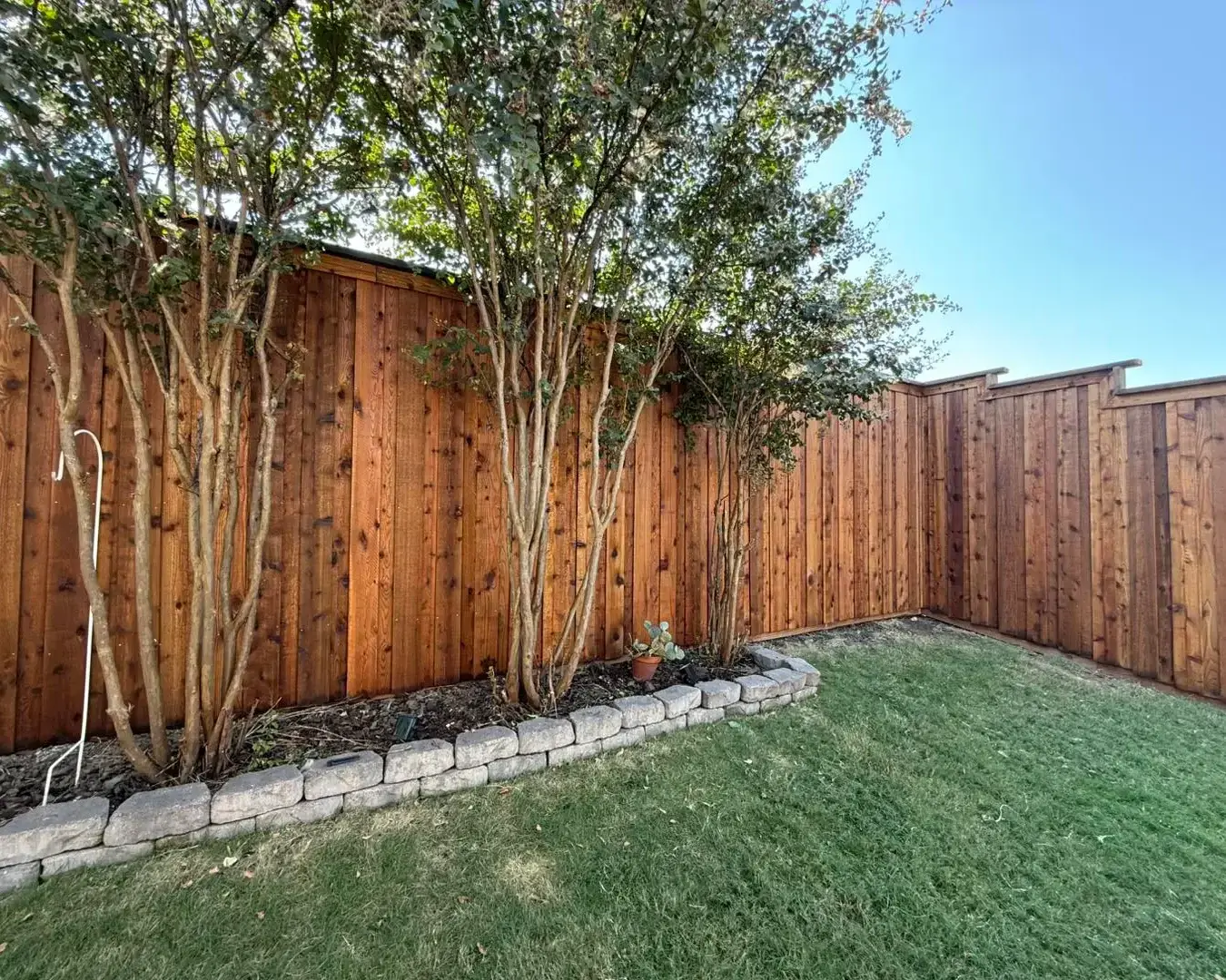 Wood fence posts - stained cedar wood fence installed, Wood Defender