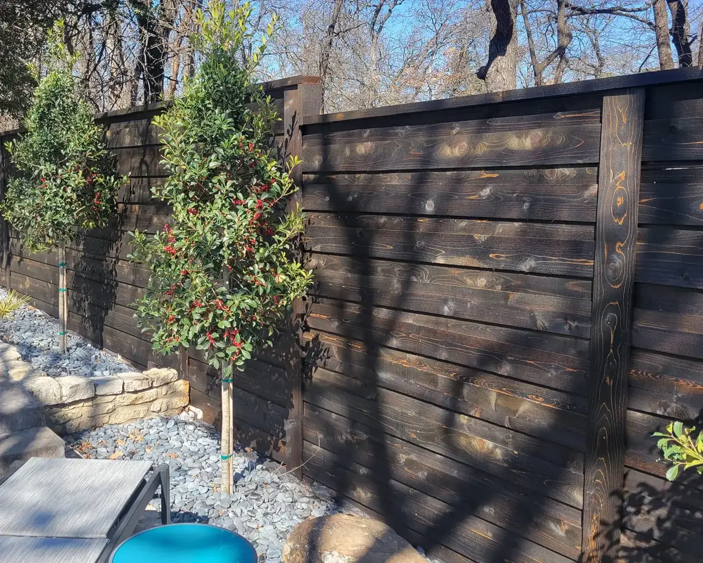Wood fence posts - stained cedar wood fence installed, Wood Defender