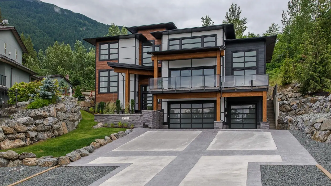Modern home clad in wood-tone and stone siding